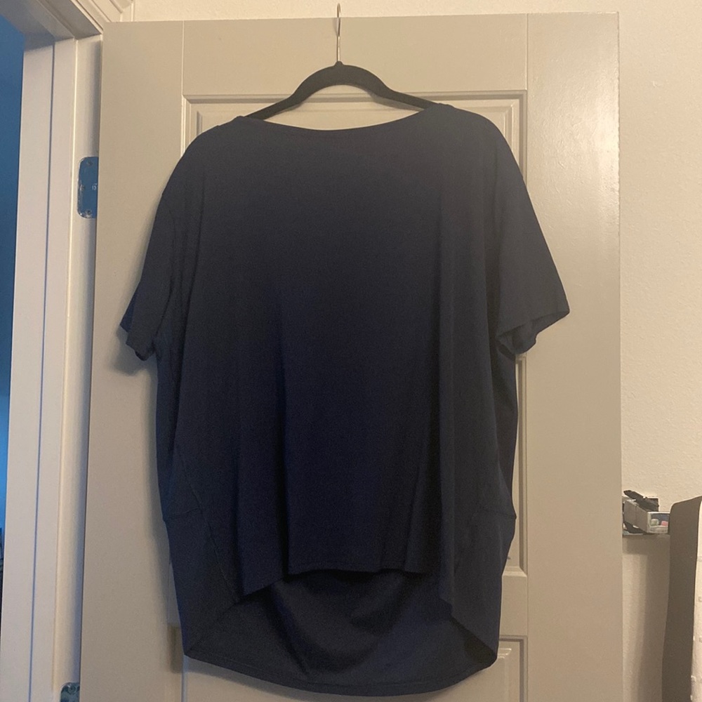 Lululemon back in action short sleeve NULU fabric size 10 navy is the color.